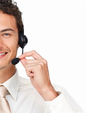 simsearch:400-05145011,k - Close-up of a young businessman using headset isolated on a white background Stock Photo - Budget Royalty-Free & Subscription, Code: 400-04691273