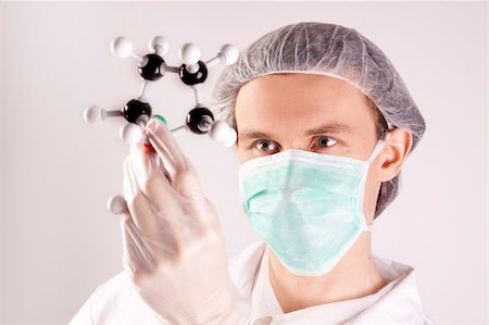 simsearch:400-09011632,k - Scientist working in laboratory arranged in studio Stock Photo - Budget Royalty-Free & Subscription, Code: 400-04691969