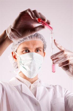 simsearch:400-09011632,k - Scientist working in laboratory arranged in studio Stock Photo - Budget Royalty-Free & Subscription, Code: 400-04691975