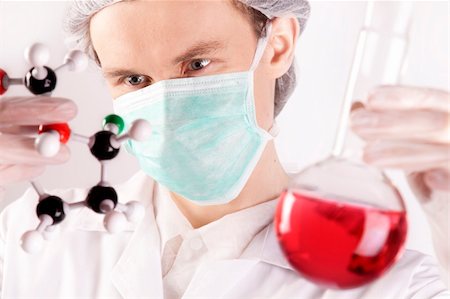 simsearch:400-09011632,k - Scientist working in laboratory arranged in studio Stock Photo - Budget Royalty-Free & Subscription, Code: 400-04691970