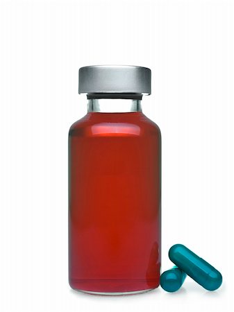 simsearch:400-05713485,k - Isolated vial full of red liquid, green pills aside. Stock Photo - Budget Royalty-Free & Subscription, Code: 400-04693274