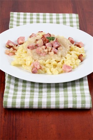 simsearch:400-04684204,k - Slovak national food called "halusky" - small potato dumplings (gnocchi) with sauerkraut and smoked meat Photographie de stock - Aubaine LD & Abonnement, Code: 400-04693475