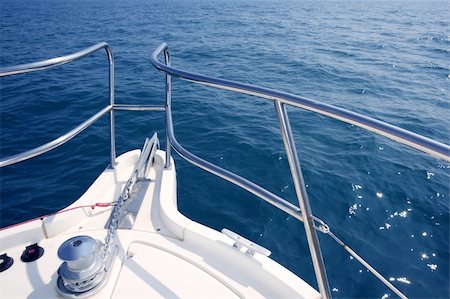 boat bow sailing on blue sea with anchor chain and winch detail Stock Photo - Budget Royalty-Free & Subscription, Code: 400-04704700