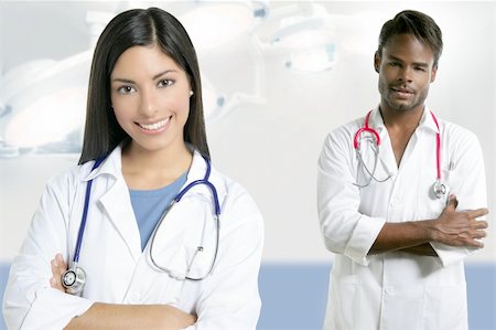 Couple of doctors asian indian woman and african man in the surgery hospital Stock Photo - Budget Royalty-Free & Subscription, Code: 400-04704820