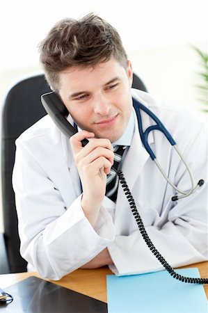 patient nurse talking office - Attractive male doctor talking on the phone in his office Stock Photo - Budget Royalty-Free & Subscription, Code: 400-04704965