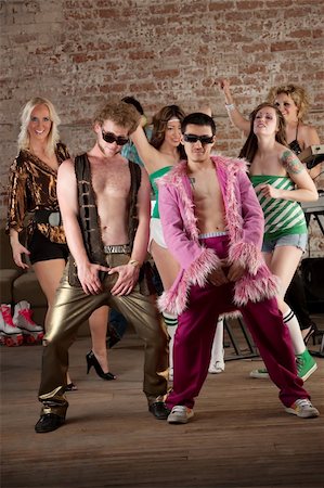 simsearch:400-04206686,k - Raunchy dancing men with sunglasses at a 1970s Disco Music Party Stock Photo - Budget Royalty-Free & Subscription, Code: 400-04705144
