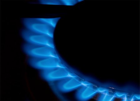 Gas flame of a stove in the dark Stock Photo - Budget Royalty-Free & Subscription, Code: 400-04706195
