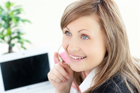 simsearch:400-05287143,k - Attractive businesswoman with headset on smiling at the camera Stock Photo - Budget Royalty-Free & Subscription, Code: 400-04700088