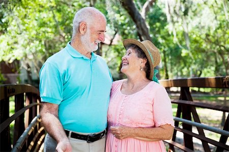 simsearch:400-04208630,k - Beautiful senior couple flirting outdoors in the park. Stock Photo - Budget Royalty-Free & Subscription, Code: 400-04700182