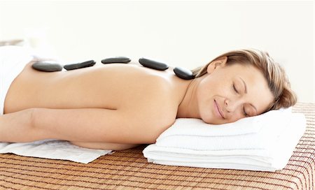 simsearch:400-04192063,k - Radiant woman with hot stones on her back in a Spa center Stock Photo - Budget Royalty-Free & Subscription, Code: 400-04701064