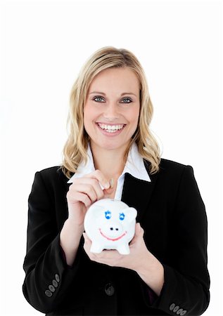 simsearch:400-04184165,k - Charming businesswoman saving money in a piggy-bank against a white background Stock Photo - Budget Royalty-Free & Subscription, Code: 400-04701475