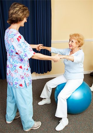 Physical therapist using pilates ball to work with senior chiropractic patient. Stock Photo - Budget Royalty-Free & Subscription, Code: 400-04702182