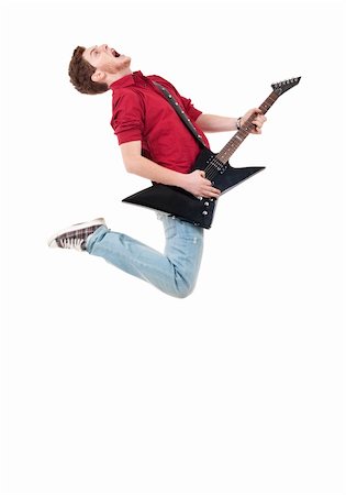 Awesome guitar player jumps with passion in studio over white Stock Photo - Budget Royalty-Free & Subscription, Code: 400-04702946
