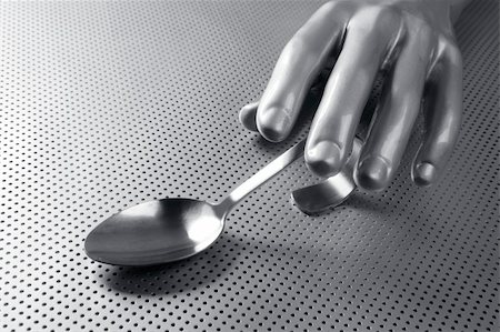 gray silver hand and spoon futuristic food modern metaphor Stock Photo - Budget Royalty-Free & Subscription, Code: 400-04703987