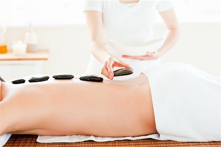 simsearch:400-04192063,k - Close-up of a young man receiving hot stone on his back in a spa center Stock Photo - Budget Royalty-Free & Subscription, Code: 400-04715362