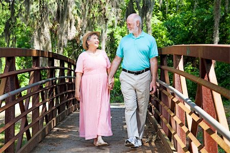 simsearch:400-04208630,k - Beautiful senior coule stays fit by walking together in the park. Stock Photo - Budget Royalty-Free & Subscription, Code: 400-04715595