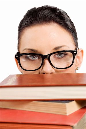 simsearch:400-04860880,k - pretty student with big glasses playing and hiding her face behind a pile of book Stock Photo - Budget Royalty-Free & Subscription, Code: 400-04717334