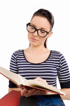 simsearch:400-04860880,k - young and graceful girl reading a book and wearing big glasses Stock Photo - Budget Royalty-Free & Subscription, Code: 400-04717335