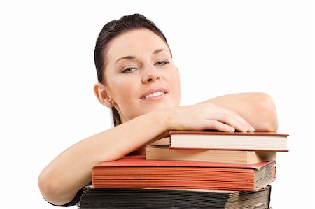 simsearch:400-04860880,k - close up portrait of young and cute brunette student posing her head over a pile of old book Stock Photo - Budget Royalty-Free & Subscription, Code: 400-04717332