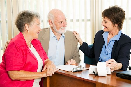 Senior couple gets good news from their accounant. Stock Photo - Budget Royalty-Free & Subscription, Code: 400-04710137