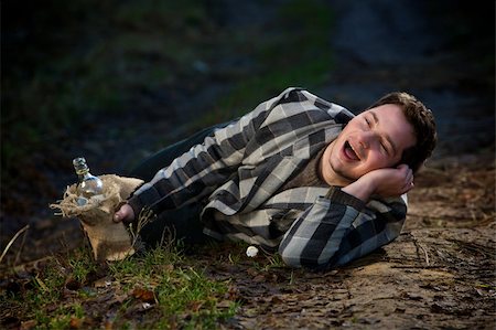 drifter - The drunkard lies on road and sings Stock Photo - Budget Royalty-Free & Subscription, Code: 400-04711751