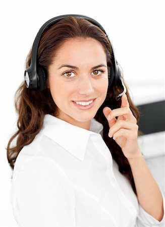 simsearch:400-05287143,k - Positive woman with headset working in a call center against a white background Stock Photo - Budget Royalty-Free & Subscription, Code: 400-04724092