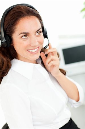 simsearch:400-05287143,k - Bright woman wearing a headset working in a customer service Stock Photo - Budget Royalty-Free & Subscription, Code: 400-04724093