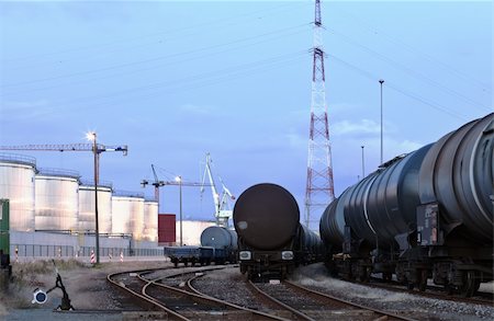 Oil tank cars standing on rail tracks in industrial area; twilight scene Stock Photo - Budget Royalty-Free & Subscription, Code: 400-04724227