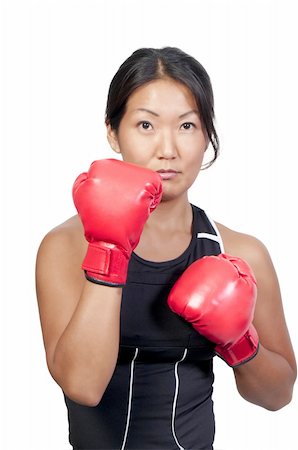 simsearch:400-04970057,k - A beautiful young woman wearing a pair of boxing gloves Stock Photo - Budget Royalty-Free & Subscription, Code: 400-04724339