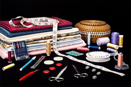 simsearch:6109-08701535,k - Sewing accessories with fabric on a black background Stock Photo - Budget Royalty-Free & Subscription, Code: 400-04725421