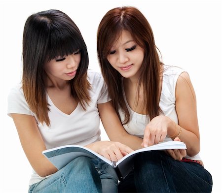 simsearch:400-05357982,k - Asian students sitting learning together on white background Stock Photo - Budget Royalty-Free & Subscription, Code: 400-04727019