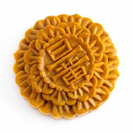 Chinese Mooncake isolated over white background, the Chinese words on the mooncake means yolk. Stock Photo - Budget Royalty-Free & Subscription, Code: 400-04727031