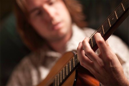 simsearch:400-04863651,k - Young Musician Plays His Accustic Guitar under Dramatic Lighting. Stock Photo - Budget Royalty-Free & Subscription, Code: 400-04727686