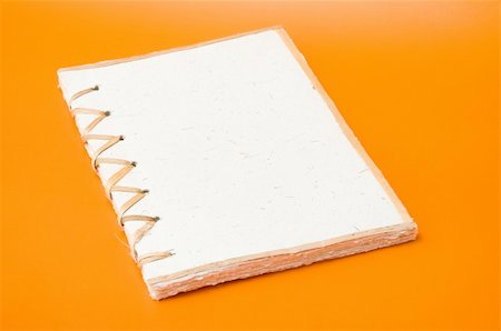 simsearch:400-04424177,k - recycled notepad over an orange background Stock Photo - Budget Royalty-Free & Subscription, Code: 400-04727950