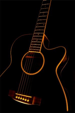 A black guitar in black background Stock Photo - Budget Royalty-Free & Subscription, Code: 400-04729896