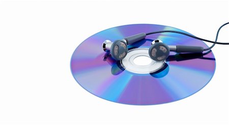 dvd silhouette - Ear-phones on cd isolated on white. Foto de stock - Super Valor sin royalties y Suscripción, Código: 400-04720349