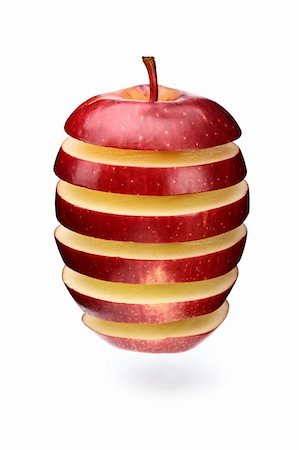 simsearch:400-05367726,k - A red apple sliced in layers and arranged with gaps Stock Photo - Budget Royalty-Free & Subscription, Code: 400-04720904