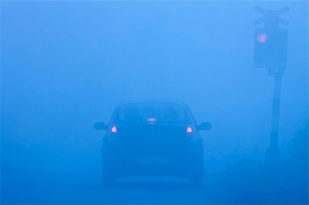 pictures of light rail transit signals - car waiting at rural railroad crossing with red lights blinking in fog Stock Photo - Budget Royalty-Free & Subscription, Code: 400-04723308