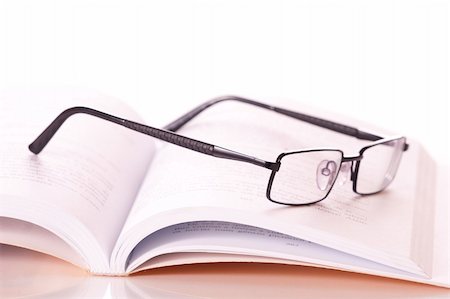 simsearch:400-07774329,k - glasses on a book Stock Photo - Budget Royalty-Free & Subscription, Code: 400-04723386