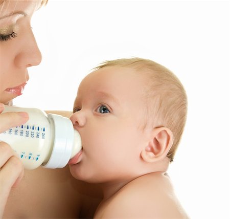 simsearch:400-06751007,k - Mother give drink her baby boy by feeding bottle over white Stock Photo - Budget Royalty-Free & Subscription, Code: 400-04723547