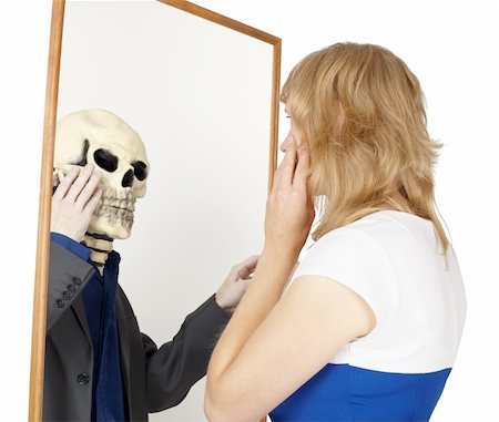 simsearch:400-04275576,k - The girl looks into a false mirror isolated on a white background Photographie de stock - Aubaine LD & Abonnement, Code: 400-04735346