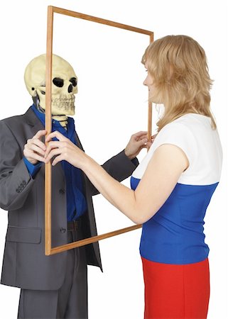 simsearch:400-04275576,k - A woman looks at a skeleton as reflected Photographie de stock - Aubaine LD & Abonnement, Code: 400-04737350