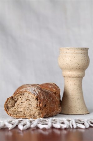 Loaf of bread and chalice with wine. Shallow dof, copy space Stock Photo - Budget Royalty-Free & Subscription, Code: 400-04730171