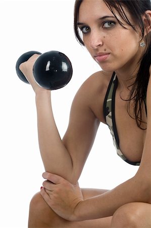 A sexy young hispanic woman wearing a gym outfit, isolated on a white background. Stock Photo - Budget Royalty-Free & Subscription, Code: 400-04731347