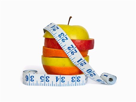 simsearch:400-05367726,k - Slices of apples and orange as one fruit and a measuring tape. Isolated with clipping path. Stock Photo - Budget Royalty-Free & Subscription, Code: 400-04731524