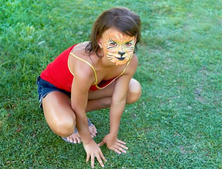 A young  girl painted up as a tiger Photographie de stock - Aubaine LD & Abonnement, Code: 400-04744194
