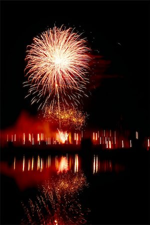 fireworks silhouette - night traditional firework with reflection in water Stock Photo - Budget Royalty-Free & Subscription, Code: 400-04744569