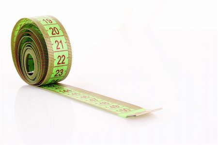 Twisted green measuring  tape isolated on white Stock Photo - Budget Royalty-Free & Subscription, Code: 400-04745351