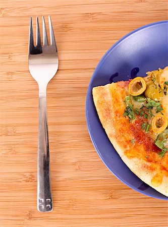 Pizza on plate with fork Stock Photo - Budget Royalty-Free & Subscription, Code: 400-04746903