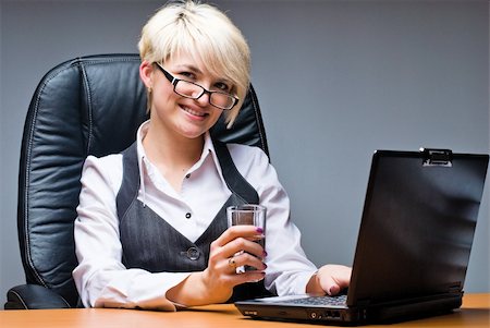 simsearch:400-05729275,k - Business woman working on her laptop in office Stock Photo - Budget Royalty-Free & Subscription, Code: 400-04747375
